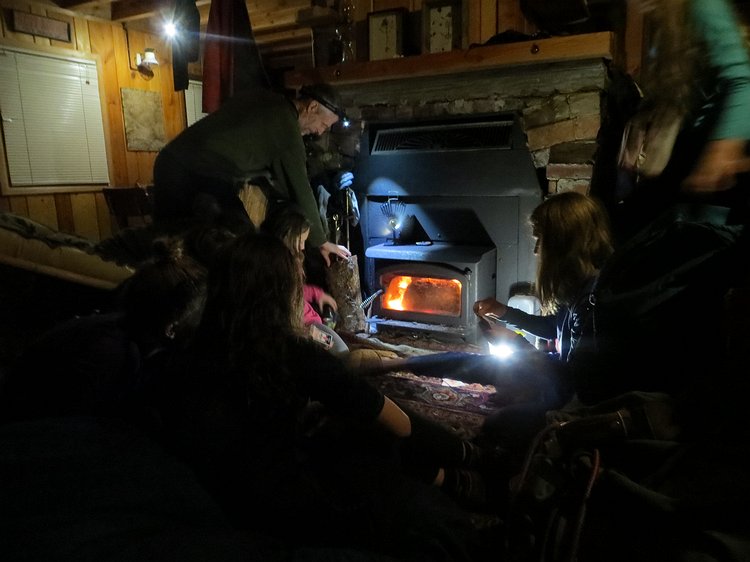 img_5140 Huddling around the wood stove to stay warm.