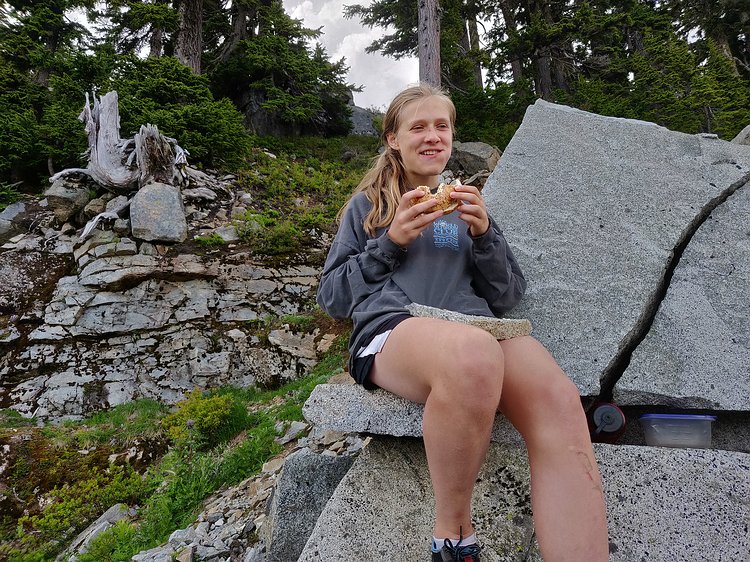 2019-06-30 15.07.37 Zoe enjoying lunch on her rock plate after making her way up to Kendall Katwalk. Thankfully the thunderstorm that'd be threatening on the hike up cleared a bit...