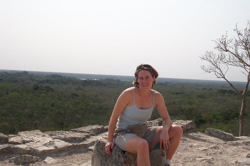 dcp_1506 Kathryn resting atop the Coba pyramid. That tree in the background is growing on the side of the pyramid.