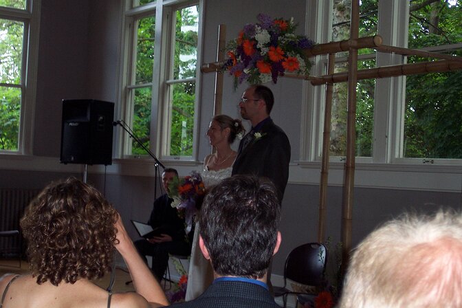 dcp_0021 Kati and Eric at the alter after surviving the walk down the isle. D'arcy's bamboo handiwork is in the background.
