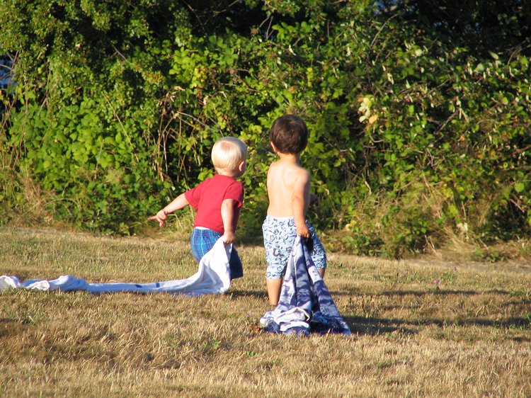 img_0560 Gavin and Aidan, and their trusty towels, head off on a trek towards the water. Brian, Aidan's dad, runs off to catch them before the disappear from sight down...