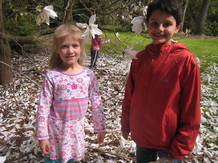 img_5396 Zoe and Aidan happy under the petal-snowing tree.