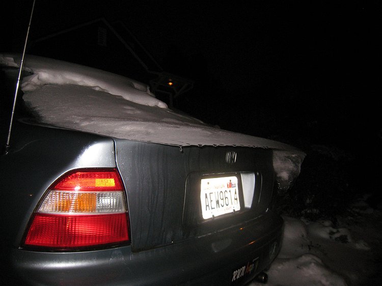 img_5260 Mysterious ice ledge hanging off the back of the car after a bit of melting of the layer of freezing rain we had in the middle of two snowstorms.