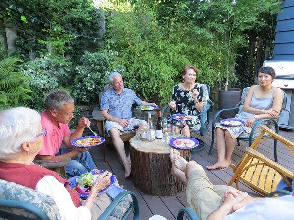 img_2102 Dinner on the back deck with a big wooden table.