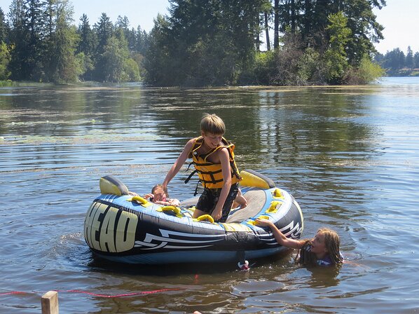 img_2351 Somehow Gavin is on top of the floaty toy while all the girls are in the water. Lets see how long that lasts.