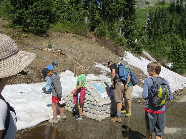 img_3858 Checking out the trail map at Chinook Pass. Still a bit of snow in July which is always fun.