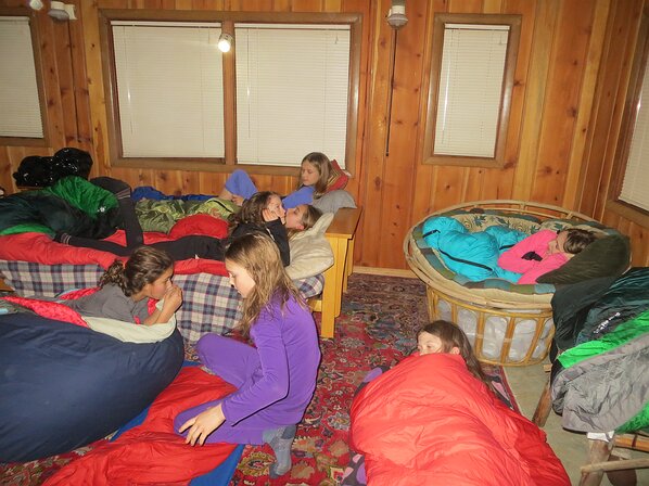 img_5150 Time to setup camp for the night. Somehow Violet slept in the spaceship chair all curled up while three girls fit onto the futon.