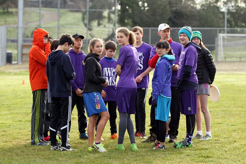 180317 8756 washington middle school ultimate a e Team huddle on a chilly morning.