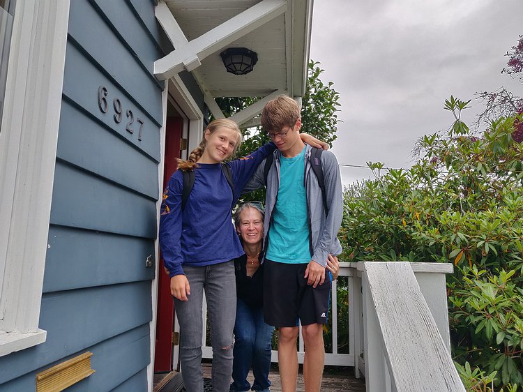2019-09-04 08.02.17 Oh, it's Kathryn! Zoe and Gavin now tower over her, quite a change from past years' first-day-of-school pictures.