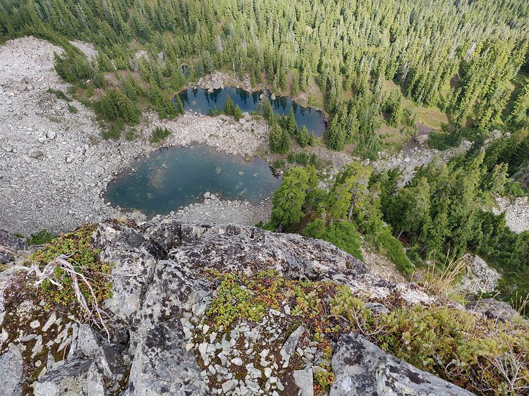 2019-09-11 12.44.00 A few small tarns at the base of Tinkham Peaks' imposing cliffs.