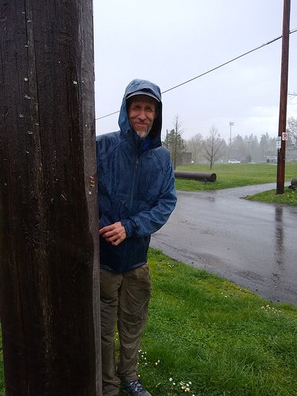 2019-04-05 15.52.54 Trying to hide on the dry side of a telephone pole during a sudden downpour while doing a neighborhood stair walk.