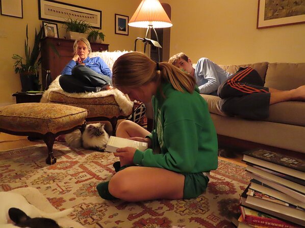 img_0028 Zoe surrounded by the whole family while checking out her new books.