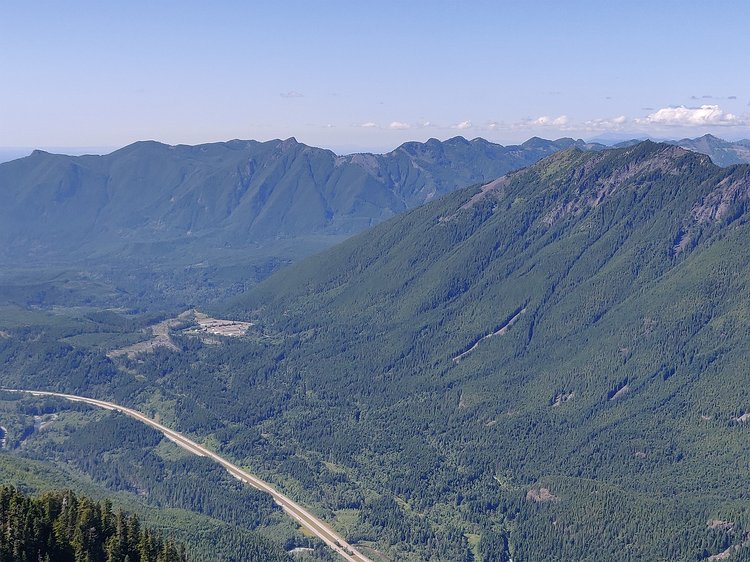 2020-07-13 16.13.33 I-90 below with lots of hikeable peaks on both sides of the Middle Fork of the Snoqualmie valley. Mt. Si is far left in the background and Mailbox Peak is the...