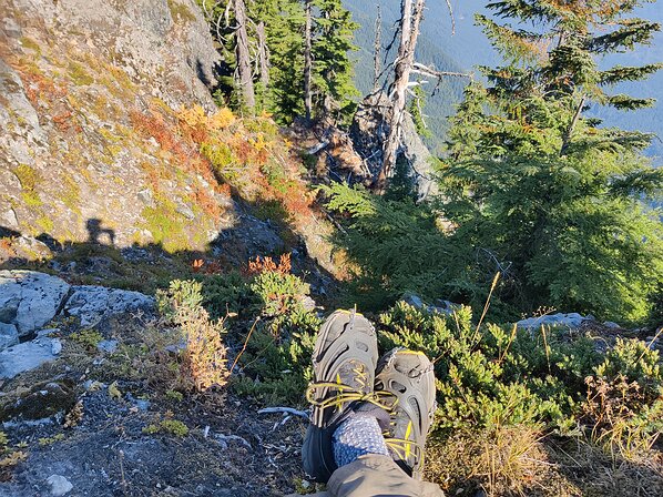 2022-10-06 14.21.48 Lunching at the top with the microspikes, which were key to getting up the slippery, slidy pine needles. The way down was a crazier misadventure.