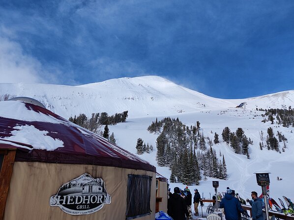 2022-02-16 13.27.21 Looking up at Big Sky's Lone Mountain from the Shedhorn Grill yurt deck.