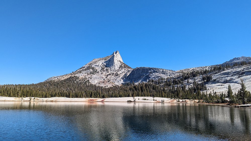 2024-10-02 12.16.01 A wider view of the granite shoreline and Cathedral Peak as we circumnavigated the lake.