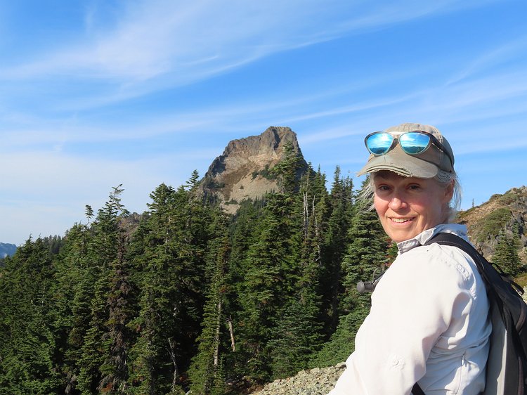 img_6134 Kathryn's facial expression tells you all you need to know about her interest in climbing up Kaleetan Peak, which is looming in the background. Looks sort of...